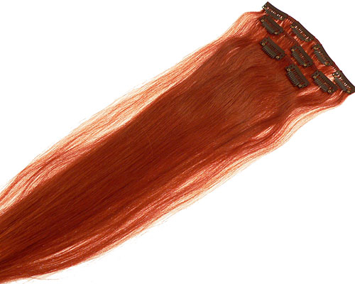Se mere om 60 cm langt clip on hår i et sæt med 3 baner i gyldenorange farve i web-butikken