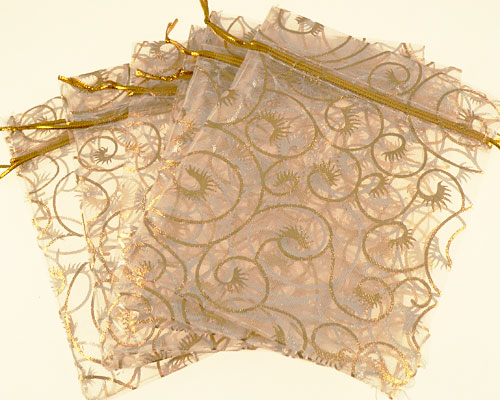 Se mere om 6 stk. gennemsigtig snørepose med guld mønster i web-butikken
